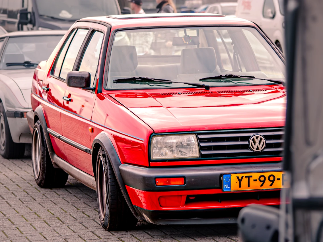 Ruben's VW Jetta parked at the TT Assen parking lot in front of an FB rx-7.